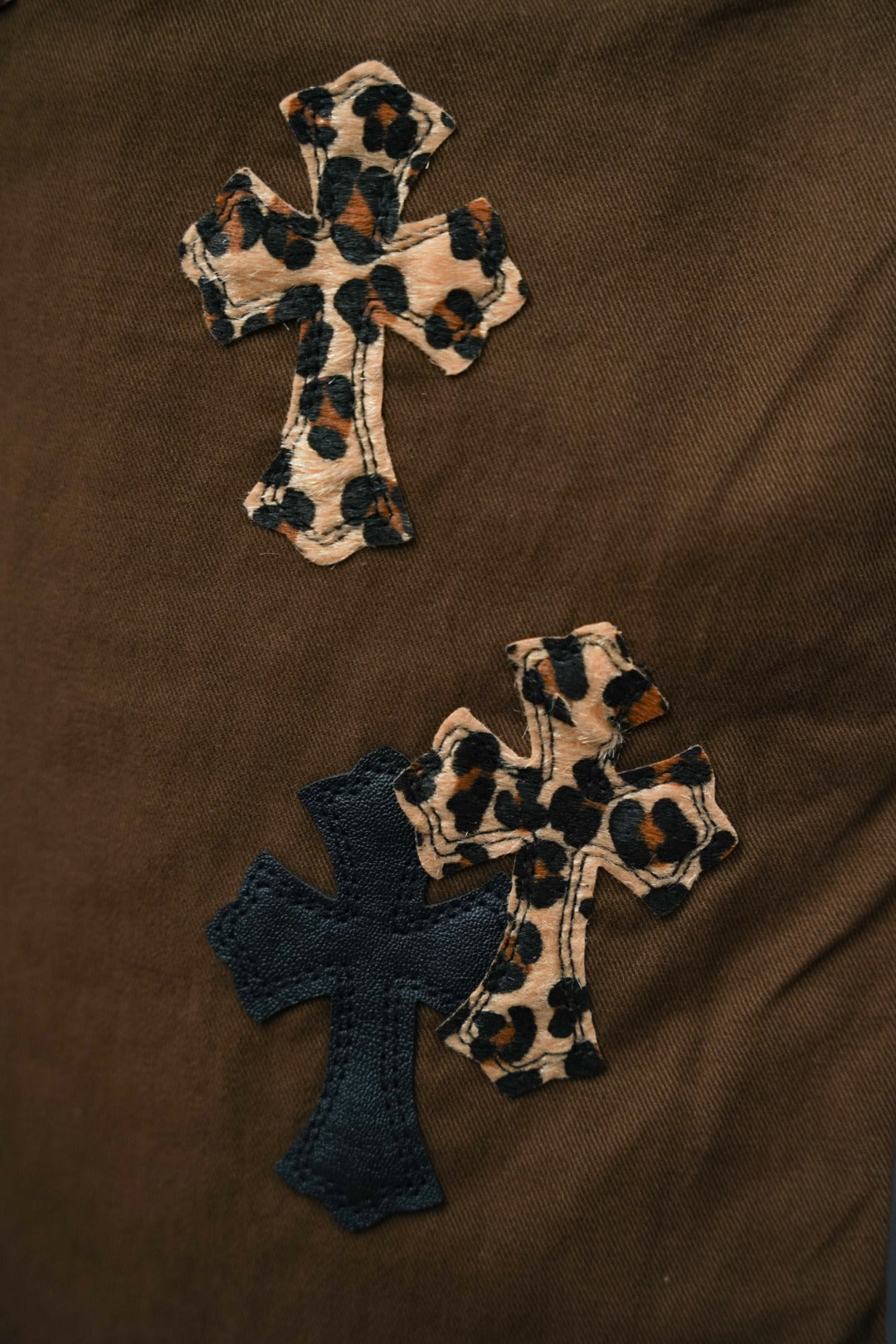 Chrome pants in brown with cross appliques and leopard-print cross details