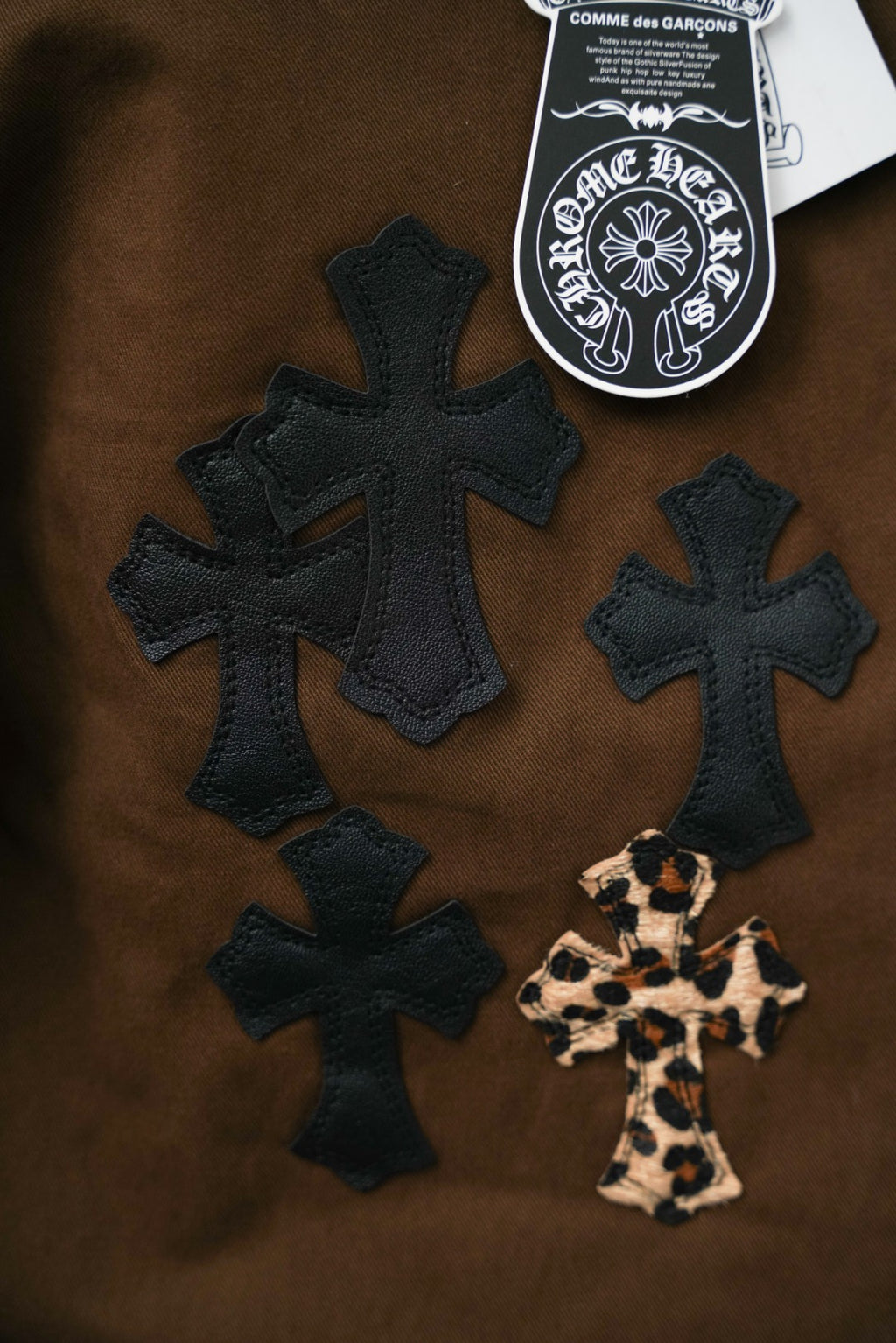 Chrome pants in dark brown with black cross appliques and leopard cross patch