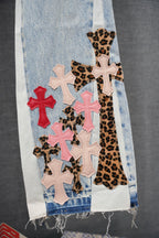 Light blue denim with leopard-print insert and pink, red, white cross patches