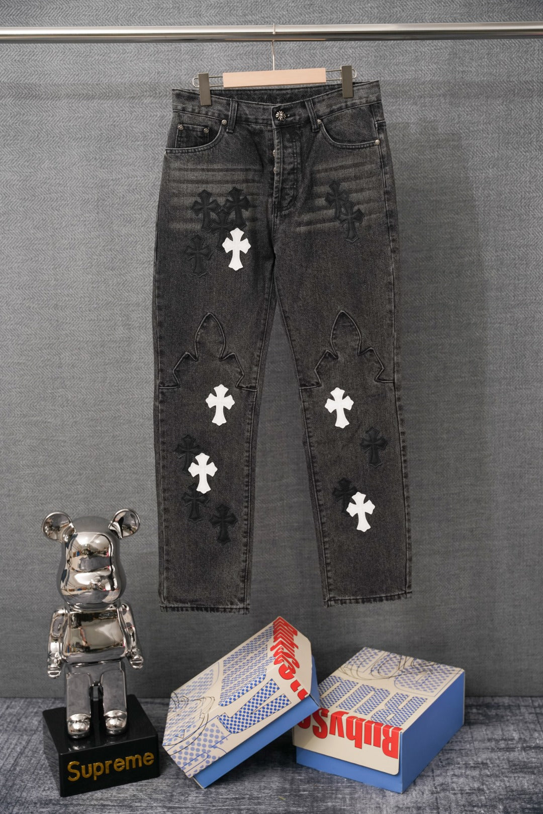 Chrome pants, dark denim with white cross patches and distressed print on legs