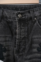 Chrome pants, close-up dark denim waistband with flower pin and riveted pockets