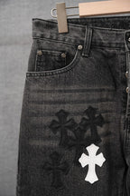 Chrome pants, dark denim front with overlapping cross applique patches near hem
