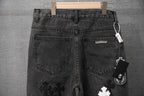 Dark denim pants with back pockets and small logo patch detail