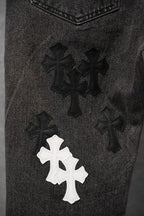 Dark denim pants with cross-style embroidered patches