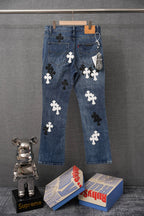 Blue denim pants with cross patches on the back and back pockets