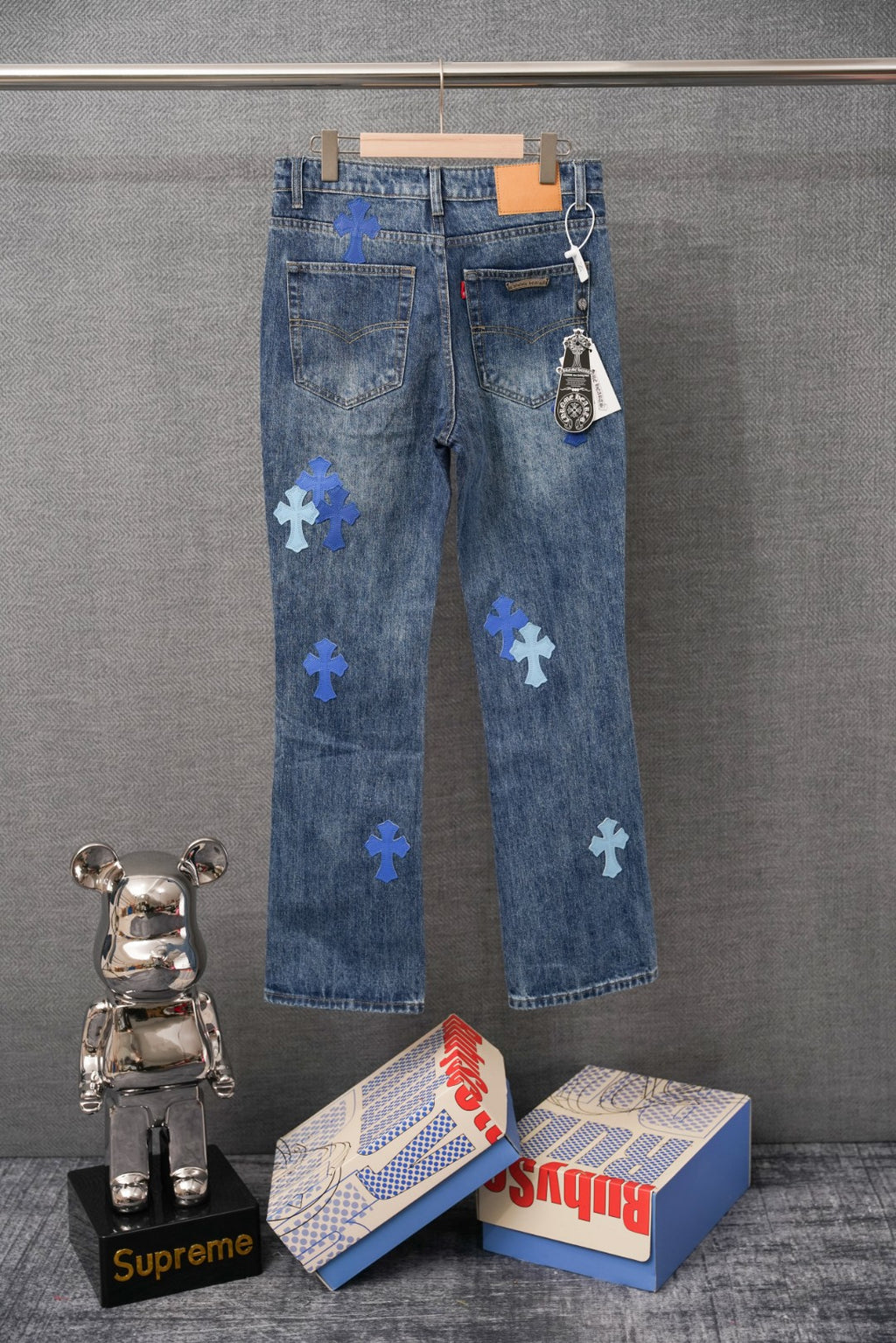 Chrome denim pants with blue cross patches and back pockets