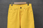 Chrome pants in bright yellow, straight waistband with front pockets and button detail.