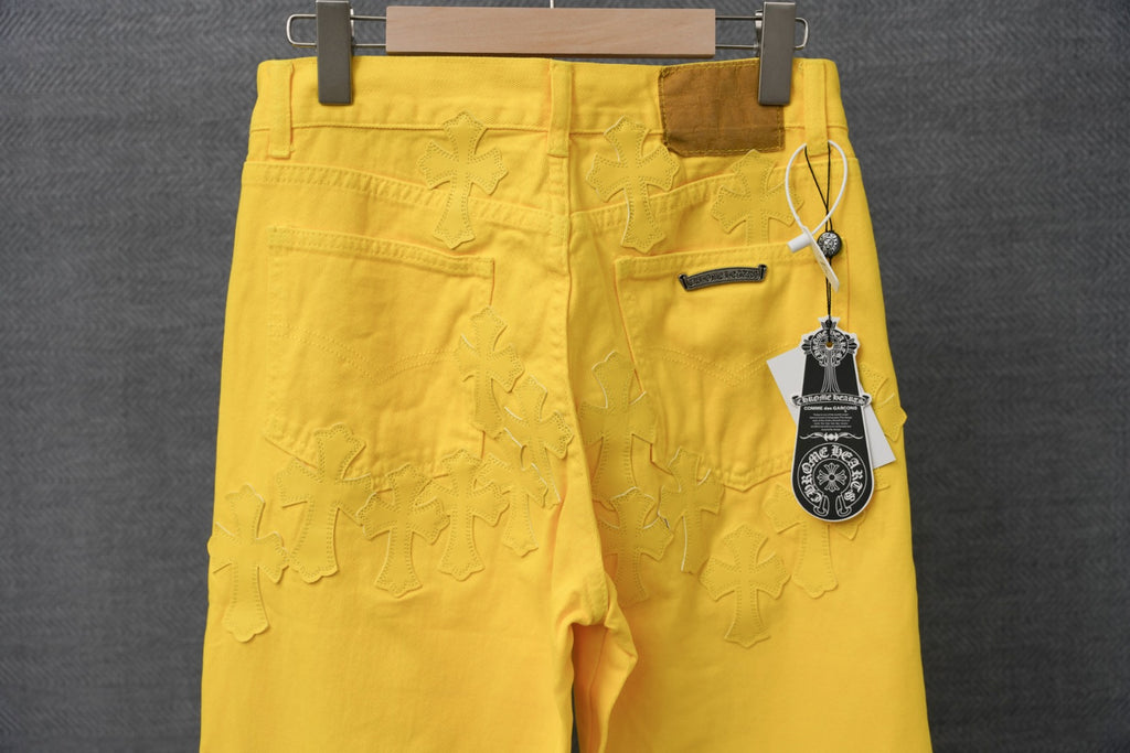 Chrome pants, yellow chino style with belt loops, pockets, and embroidered detail