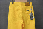 Chrome pants in yellow with front button, zip fly, and patterned cross stitching