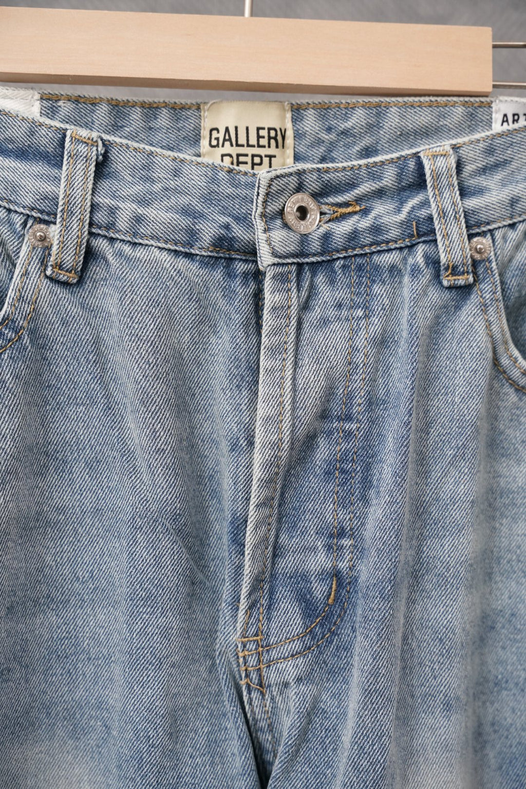 Light blue denim waistband with button closure and belt loops