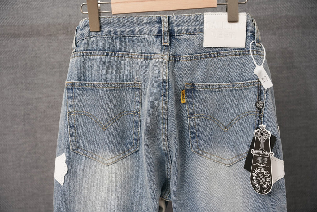 Light blue denim pants with back pockets and hanging charm tag