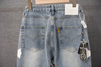 Light blue denim pants with back pockets and hanging charm tag