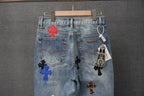 Denim jeans with multiple cross appliques and a hanging tag