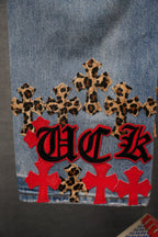 Denim Chrome pants with leopard and red cross patches and 'Chrome' graphic