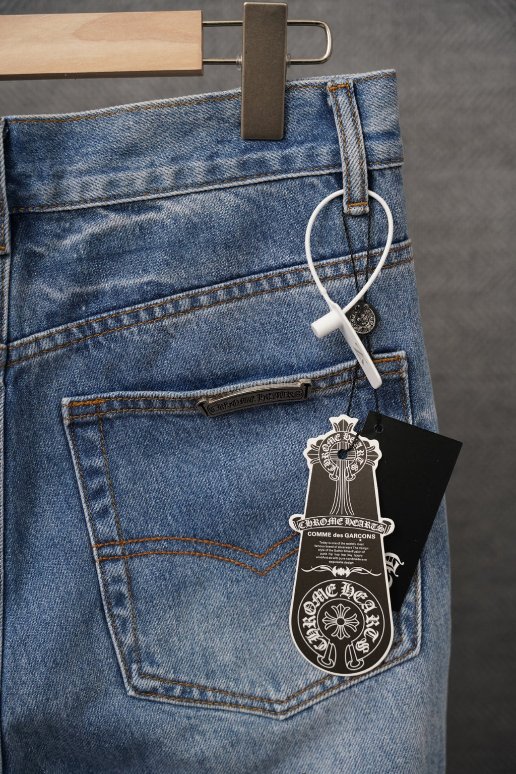 Chrome pants denim with front pocket, hang tag, and leopard patch accents