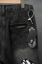 Chrome pants, dark denim front with logo patch and hanging keychain tag