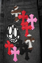 Dark denim pants with multicolor cross appliques and large skull patch