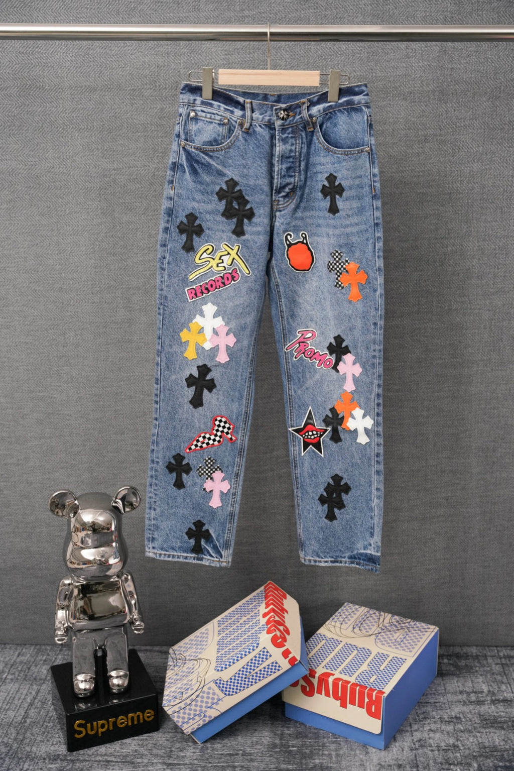Light blue denim pants with Sex Records and cross graphic patches