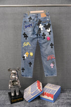 Light blue denim wide-leg pants with colorful patch graphics and labels