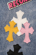 Light blue denim pants with RECORDS text and large cross patches in pink yellow