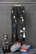 Chrome pants in dark denim with scattered colorful cross appliques