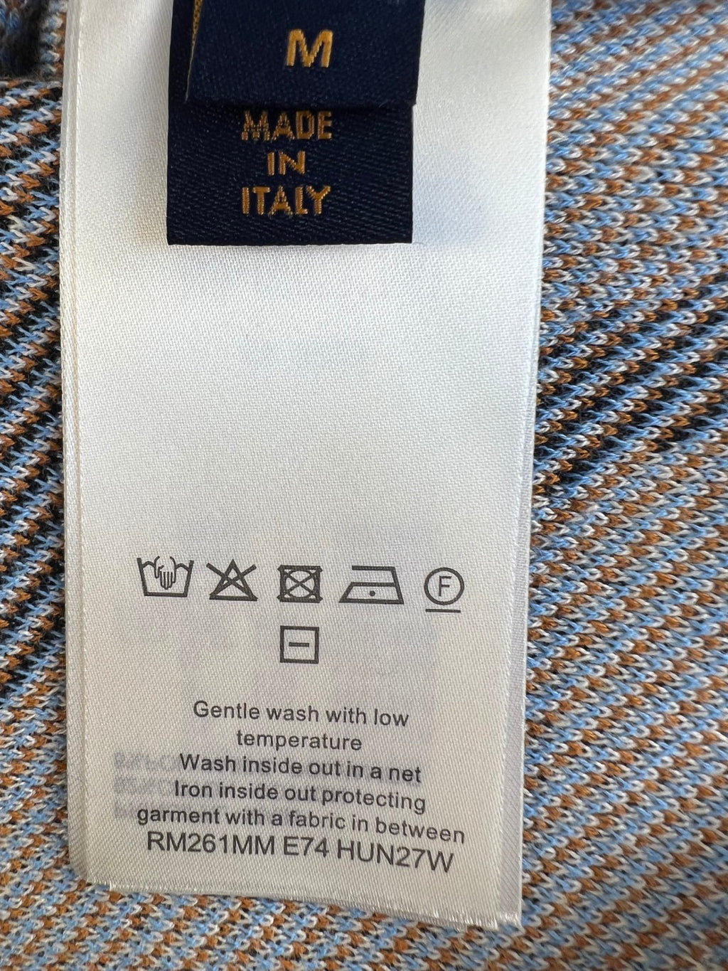 Louis Vuitton care label with size M, Made in Italy, and washing instructions