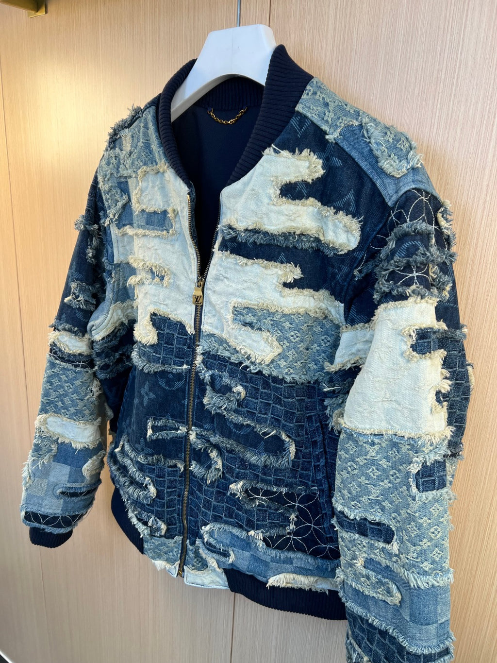 Louis Vuitton patchwork denim bomber jacket with zip front and textured panels