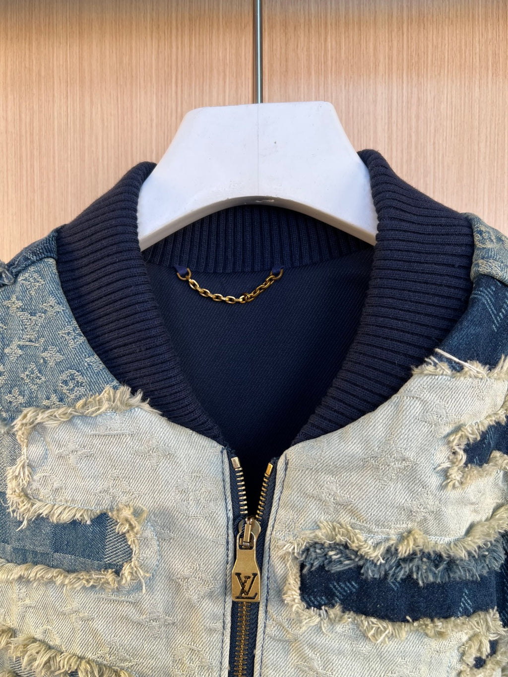 Louis Vuitton ribbed mock neck with gold chain detail and zip placket