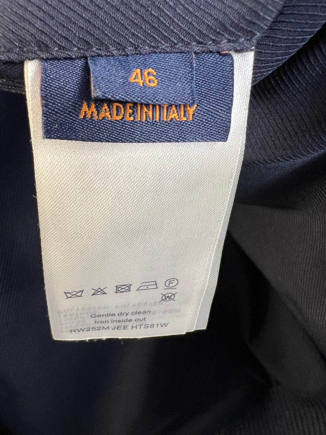 Denim jacket inner tag showing size 46 and care instructions