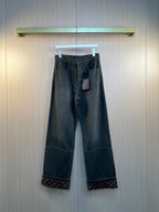 Dark gray wide-leg pants with belt loops, button-zip front, and patch pockets
