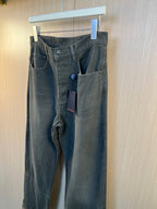 Dark gray wide-leg pants with belt loops, front pleats, patch pockets, and hang tag