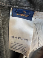 Inside care label on pants waistband, showing Made in Taiwan and washing icons