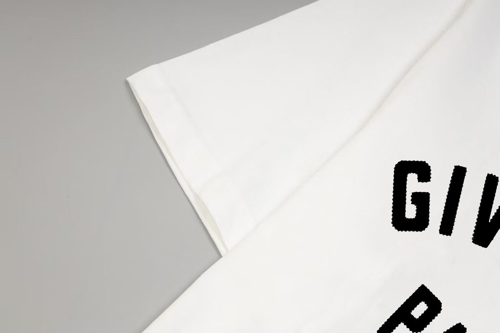 White T-shirt sleeve with partial Givenchy Paris logo print