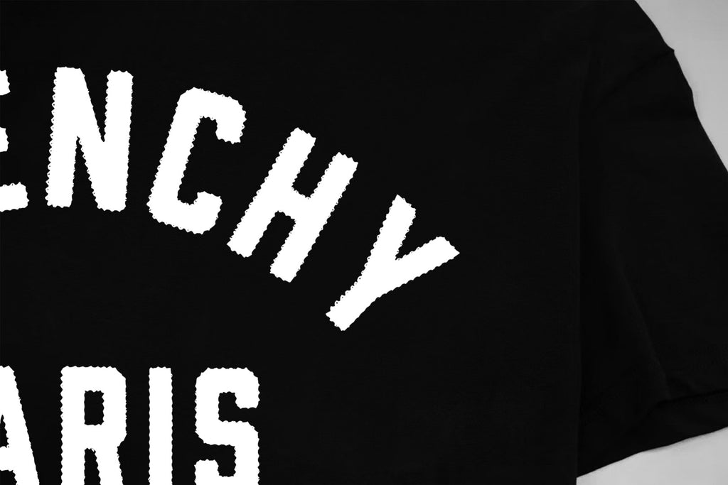 Givenchy Paris logo T-shirt close-up, large white 'GIVENCHY' print