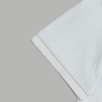 White polo shirt sleeve cuff and hem edge detail