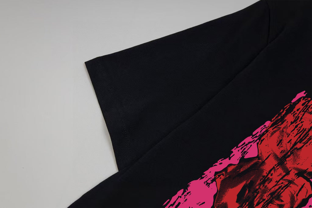 Black Givenchy T-shirt sleeve detail with pink graphic edge
