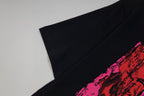 Black Givenchy T-shirt sleeve detail with pink graphic edge