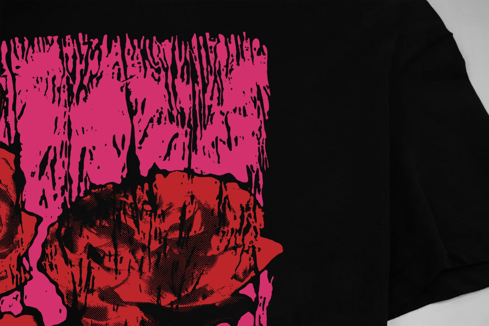 Black Givenchy T-shirt close-up of pink distressed front graphic