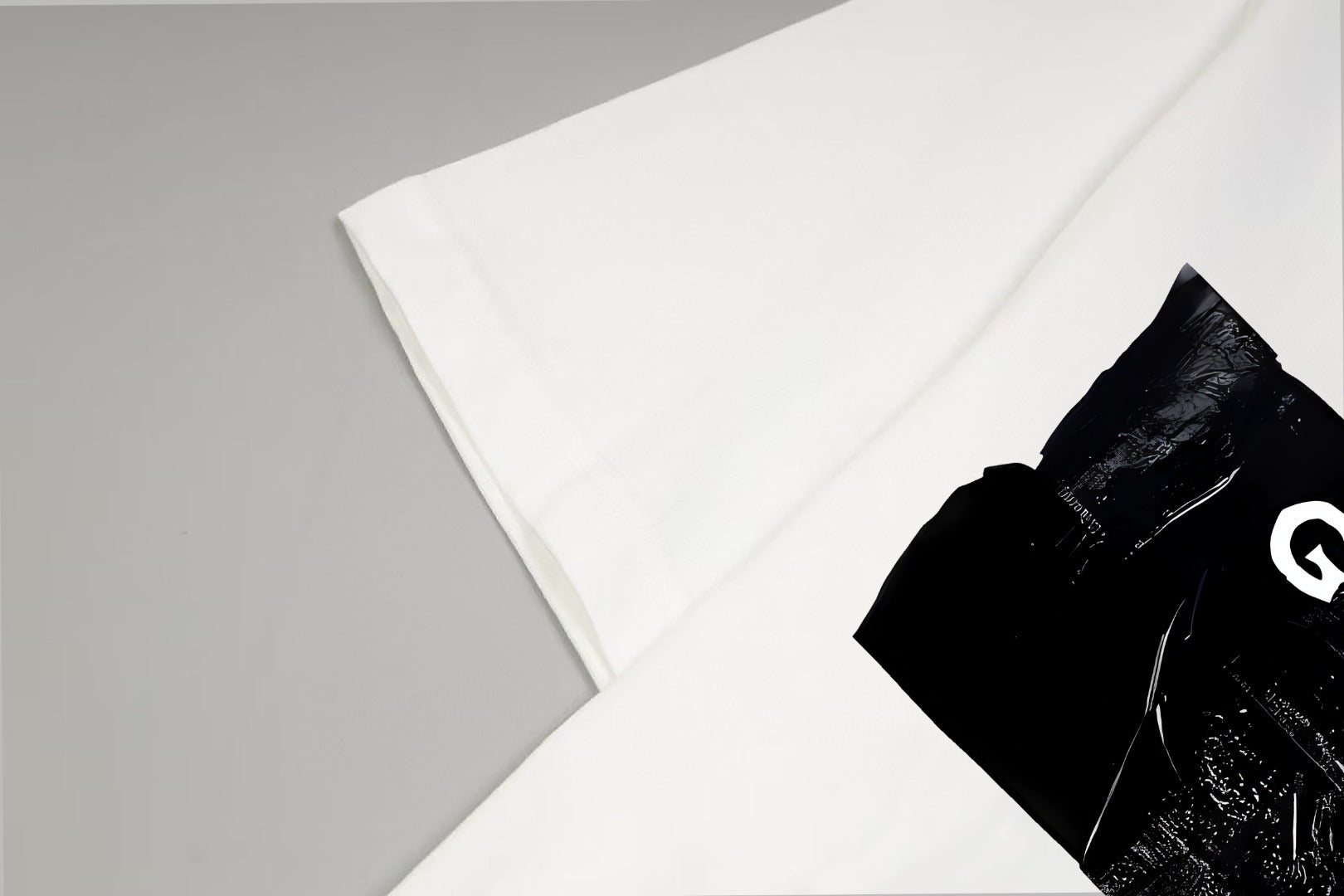 White T-shirt with partial black front graphic detail