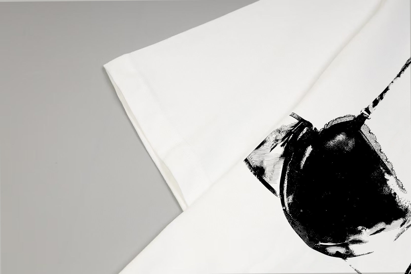 Givenchy T-shirt close-up, white fabric with black bra graphic