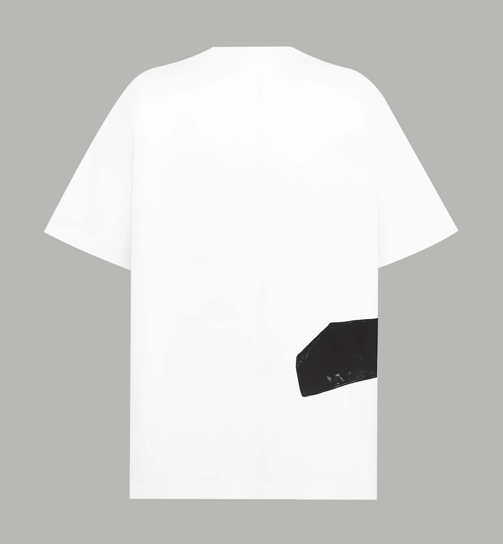 White T-shirt back with black graphic patch on lower right