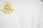 White Versace T-shirt with gold Medusa crest and green VERSACE text