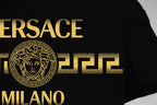 Black Versace T-shirt close-up of gold VERSACE MILANO logo