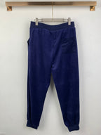 Dark blue jogger pants with elastic waistband and relaxed tapered legs