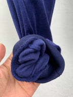 Dark blue ribbed ankle cuff detail with gathered fabric