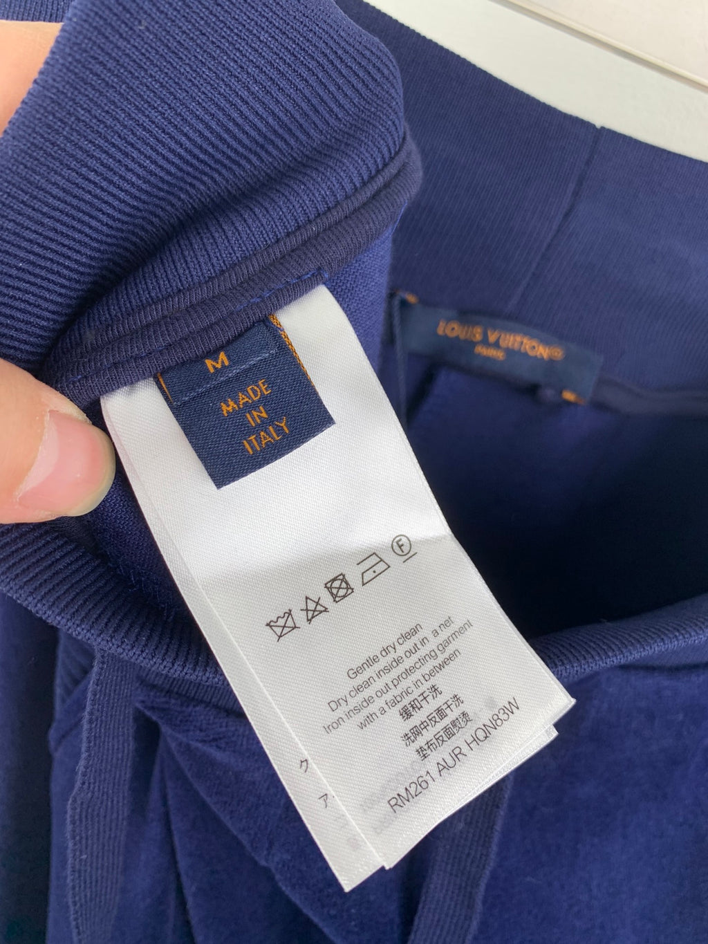 Navy pants with Louis Vuitton interior size and care label on waistband