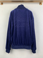 Blue Louis Vuitton zip-up jacket back view with crew logo script on fabric