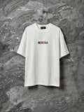 White short-sleeve T-shirt with small red logo print on chest