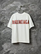 White short-sleeve T-shirt with large red Balenciaga logo across front