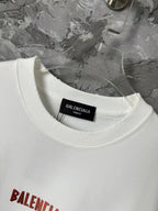 White crewneck T-shirt with black size label inside the collar